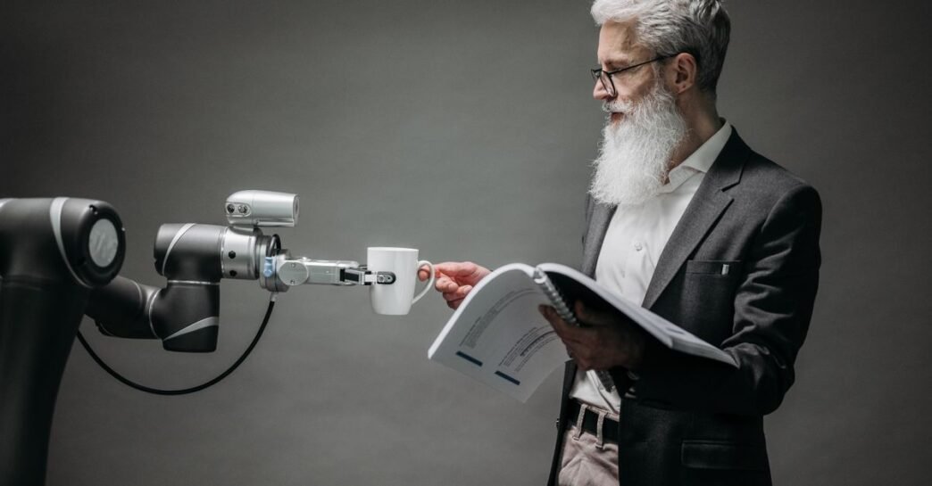 A scientist interacts with a robot helper, demonstrating modern technological innovation.
